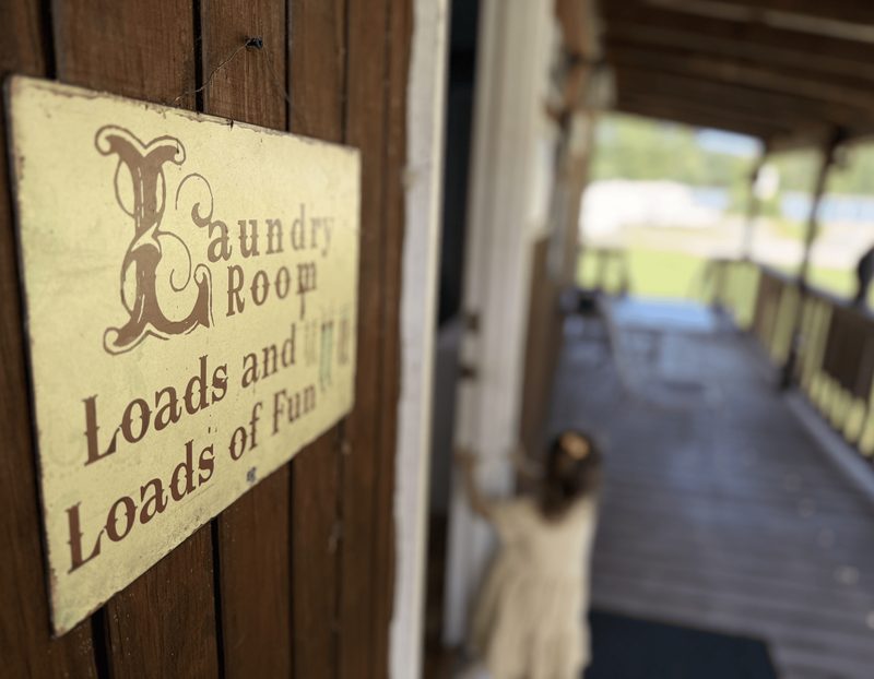 The campground laundry room with a hand-painted Loads and Loads of Fun sign.